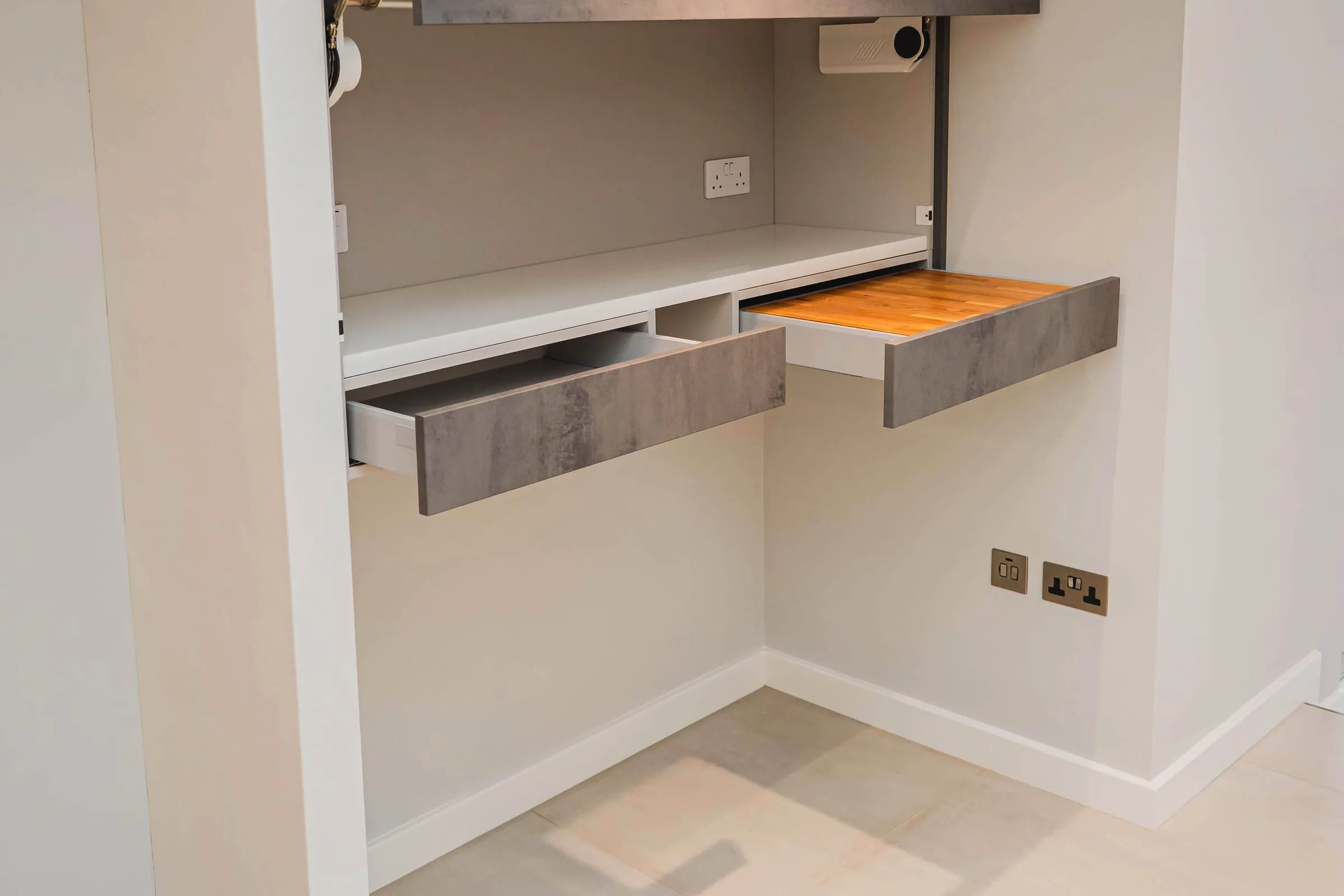 Fold-up desk set into a fitted office alcove